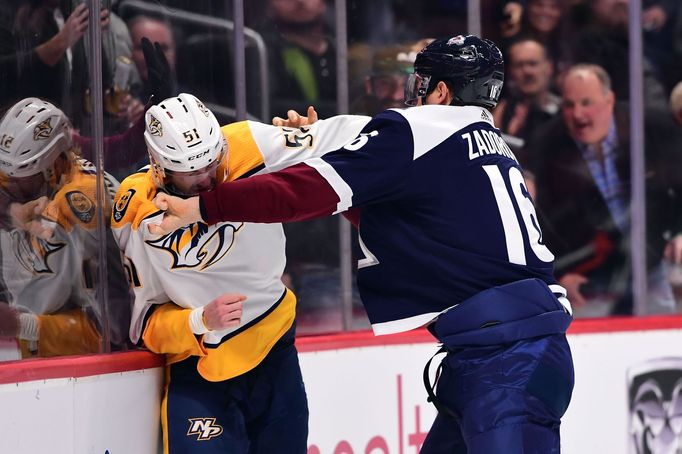 Jan 21, 2019; Denver, CO, USA; Nashville Predators left wing Austin Watson (51) and Colorado Avalanche defenseman Nikita Zadorov (16) fight in the first period at the Pep