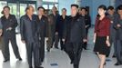 North Korean leader Kim Jong-Un (C) and his wife (red), who was named by the state broadcaster as Ri Sol-ju, visit the Rungna People's Pleasure Ground in Pyongyang in this undated picture released by the North's KCNA on July 25, 2012. Kim Jong-un has married, state media said on Wednesday, putting an end to speculation over the relationship with a woman seen at his side during a recent gala. REUTERS/KCNA (NORTH KOREA - Tags: POLITICS) THIS IMAGE HAS BEEN SUPPLIED BY A THIRD PARTY. IT IS DISTRIBUTED BY REUTERS AS A SERVICE TO CLIENTS. NO THIRD PARTY SALES. NOT FOR USE BY REUTERS THIRD PARTY DISTRIBUTORS. QUALITY FROM SOURCE Published: Čec. 25, 2012, 1:34 odp.