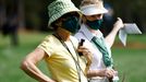 Golf - The Masters - Augusta National Golf Club - Augusta, Georgia, U.S. - November 12, 2020 Spectator wearing a protective face mask watches on during the first round RE