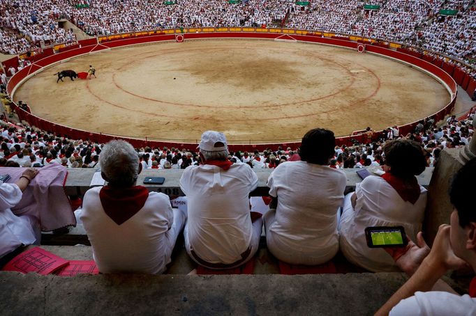 Soccer Football - Euro 2024 - Fans gather for the Final - Spain v England - Pamplona, Spain - July 14, 2024 Spain fan watches the final on his phone, in the stands bullri