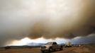 Smoke from the Waldo Canyon fire hovers over the I-25 north of Colorado Springs in Colorado June 26, 2012. A monster Colorado wildfire raging near some of the most visited tourist areas in the state took a turn for the worse on Tuesday as hot winds pushed flames north, prompting the evacuation of 7,000 more people, officials said. REUTERS/Rick Wilking (UNITED STATES - Tags: DISASTER ENVIRONMENT) Published: Čer. 27, 2012, 12:49 dop.