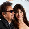 Actor Al Pacino and his girlfriend Lucila Sola pose as they arrive for the premiere of &quot;The Humbling&quot; at the Toronto International Film Festival