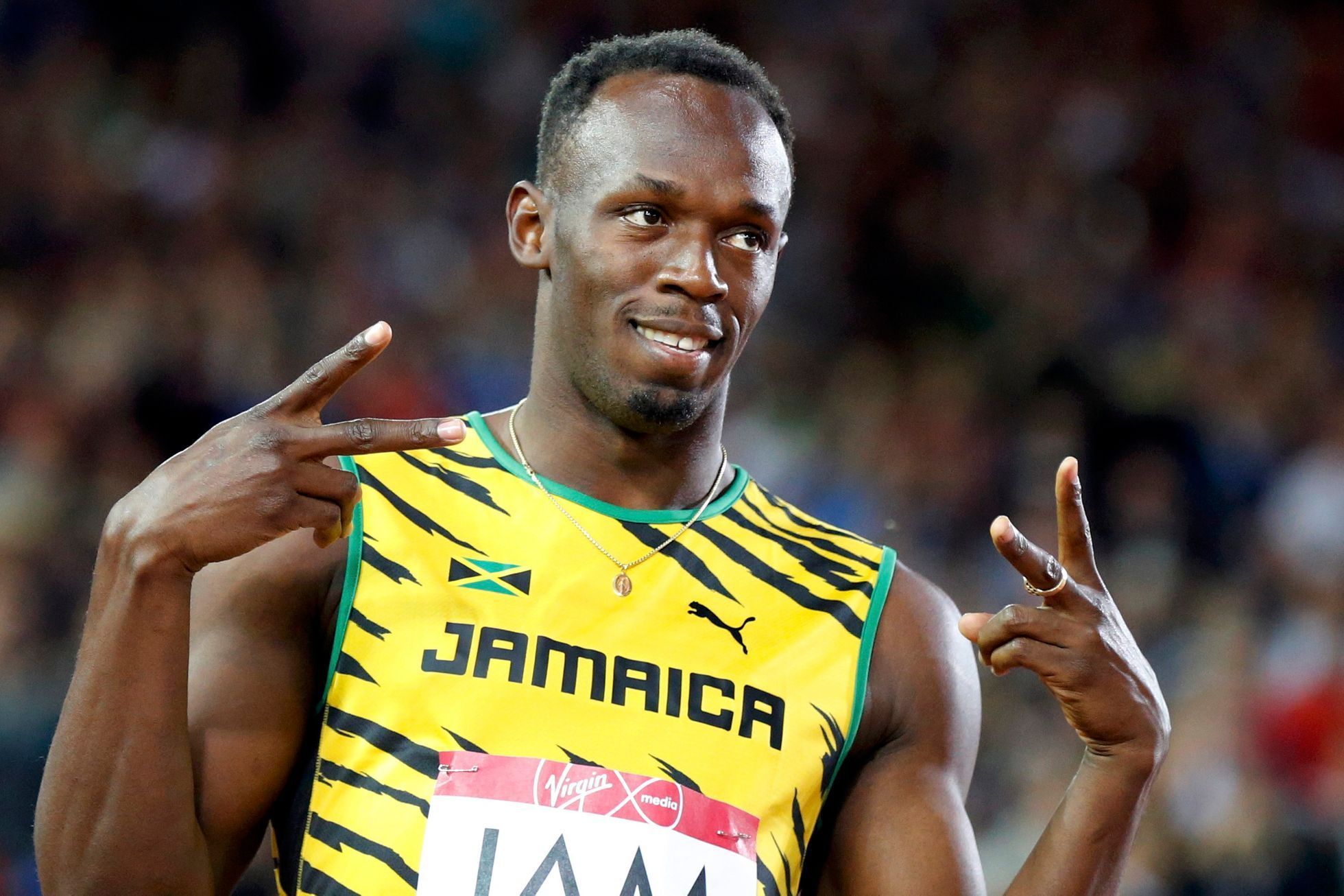 Bolt of Jamaica gestures before competing in a heat of the men's 4x100m relay at the 2014 Commonwealth Games in Glasgow