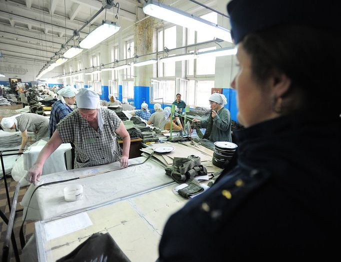 Ivanovo Region prison colony for convicted women Ivanovo Region prison colony for convicted women IVANOVO REGION, RUSSIA. APRIL 25, 2012. A prison guard supervises convicted women in the sewing room at Women's Prison Colony No3 of the Ivanovo Region branch of the Russian Federal Service of Execution of Sentences (UFSIN) pose for photographs during a fashion show.