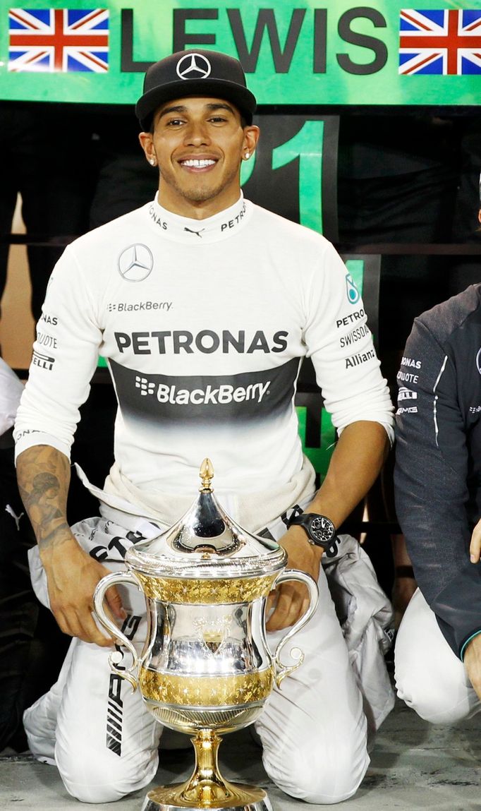 Mercedes Formula One driver Lewis Hamilton of Britain poses for pictures after winning the Bahrain F1 Grand Prix at the Bahrain International Circuit (BIC) in Sakhir, sou