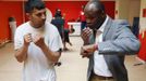 Former Belgian boxing champion Bea Diallo gives instructions to unemployed Mohamed Sammar (L) during a "Fit for a job" boxing class in Brussels July 5, 2013. Sammar, 27, has been looking for a job in the construction sector for 2 years. "Fit for a job" is the initiative of former Belgian boxing champion Bea Diallo, whose goal was to restore the confidence of unemployed people and help them find a job through their participation in sports. Picture taken July 5, 2013. REUTERS/Francois Lenoir (BELGIUM - Tags: SPORT BOXING SOCIETY BUSINESS EMPLOYMENT) Published: Čec. 5, 2013, 4:50 odp.