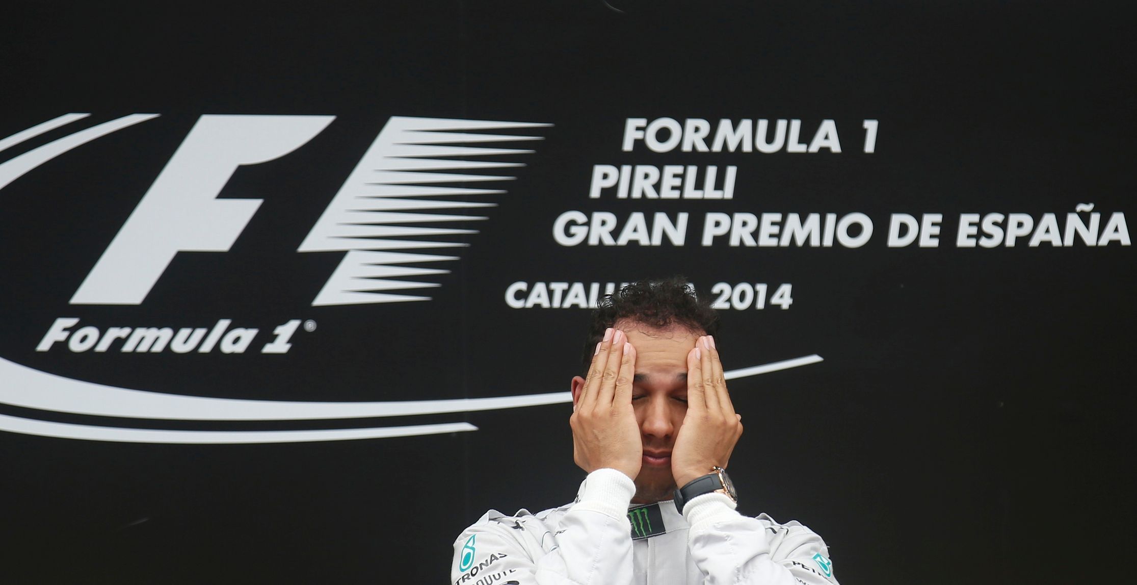 First placed Mercedes Formula One driver Hamilton of Britain reacts on podium after the Spanish F1 Grand Prix at the Barcelona-Catalunya Circuit in Montmelo