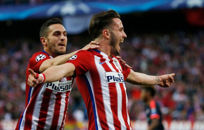 Saul Niguez celebrates with Koke after scoring the first goal for Atletico Madrid