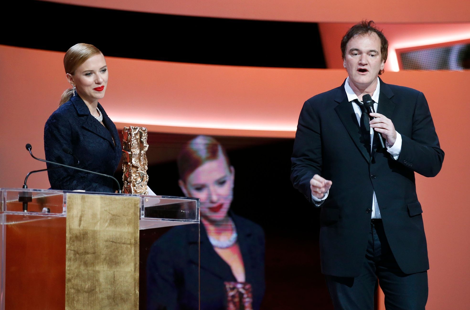 U.S. actress Johansson listens to U.S. director Tarantino after she was awarded with an Honorary award during the 39th Cesar Awards ceremony in Paris