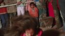 People watch a devotee who is believed to be possessed by evil spirits dance in a state of trance at Guru Deoji Maharaj temple during a ghost fair at Malajpur village in Betul district in the central Indian state of Madhya Pradesh January 27, 2013. People from across India come to this fair to be exorcised of �evil spirits�. They are usually brought by relatives and they are most often women. The exorcism involves running around the temple courtyard to make the 'ghost' weak then being beaten by a priest with a broom. Picture taken January 27, 2013. REUTERS/Danish Siddiqui (INDIA - Tags: SOCIETY RELIGION) ATTENTION EDITORS: PICTURE 23 OF 24 FOR PACKAGE 'INDIAN GHOSTBUSTERS' SEARCH 'INDIA GHOST' FOR ALL IMAGES Published: Úno. 5, 2013, 5:10 dop.