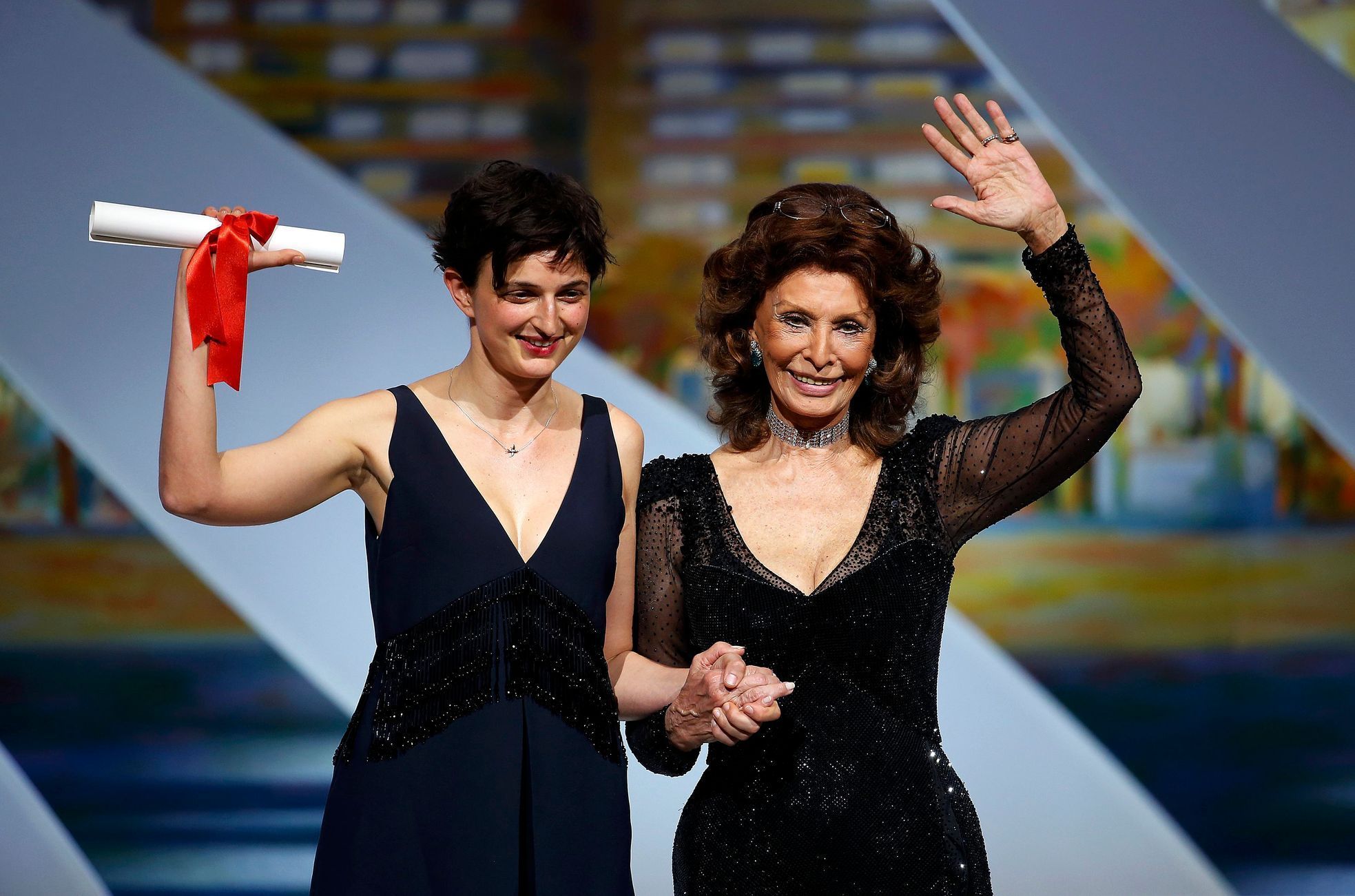 Director Alice Rohrwacher, Grand Prix award winner for her film &quot;Le meraviglie&quot;, poses on stage with actress Sophia Loren during the closing ceremony of the 67th Cannes Film Festival in Cann
