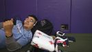 A man watches a movie on his phone at a Red Cross shelter in Hampton Bays, New York October 29, 2012. Hurricane Sandy, the monster storm bearing down on the East Coast, strengthened on Monday after hundreds of thousands moved to higher ground, public transport shut down and the stock market suffered its first weather-related closure in 27 years. REUTERS/Lucas Jackson (UNITED STATES - Tags: ENVIRONMENT DISASTER) Published: Říj. 29, 2012, 11:32 odp.