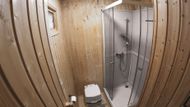 Tiny house má kromě postele, krbu a kuchyňského koutu vlastní sprchový kout a chemický záchod.