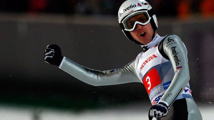 Ammann from Switzerland reacts after the first jump of the 62nd four-hills ski jumping tournament in Oberstdorf