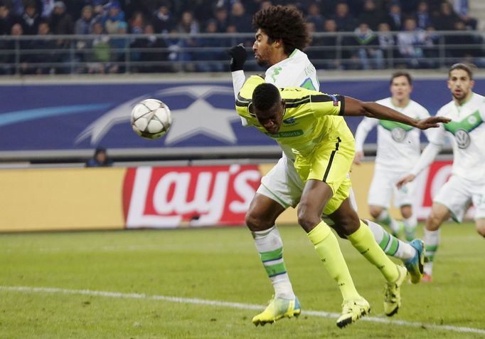 KAA Gent's Kalifa Coulibaly scores past VfL Wolfsburg's Dante