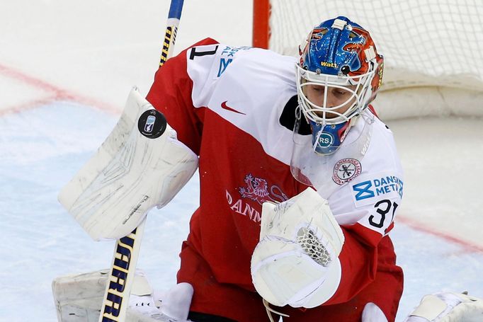 Denmark's goalie Simon Nielsen eyes the puck during the first period of their men's ice hockey World Championship Group A game against the Czech Republic at Chizhovka Are