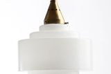 Sklárny Josef Inwald ve 30. letech 20. století udávaly trend především trhu se speciálním reflektorovým osvětlením a hravě konkurovaly takovým značkám, jako je Phillips. Toto funkcionalistické svítidlo z opálového skla a niklované mosazi navrhl pro pražskou firmu v roce 1931 Miroslav Pavel. Viselo například v letištní restauraci ve francouzském Lyonu.