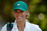 Zřejmě nejznámější tváří mezi partnerkami golfistů je dánská tenistka Caroline Wozniacká.