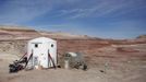 The Mars Desert Research Station (MDRS) is seen in the Utah desert March 2, 2013. The MDRS aims to investigate the possibility of a human exploration of Mars and uses the Utah desert's Mars-like terrain to simulate working conditions on the red planet. Scientists, students and enthusiasts work together to develop field tactics and study the terrain while wearing simulated spacesuits and carrying air supply packs. They live together in a small communication base with limited space and supplies. Picture taken March 2, 2013. REUTERS/Jim Urquhart (UNITED STATES - Tags: SCIENCE TECHNOLOGY SOCIETY ENVIRONMENT) ATTENTION EDITORS: PICTURE 2 OF 31 FOR PACKAGE 'MARS IN THE DESERT' SEARCH 'JIM MARS' FOR ALL IMAGES Published: Bře. 11, 2013, 2:01 odp.