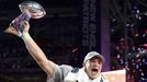 New England Patriots tight end Rob Gronkowski holds up the Vince Lombardi Trophy after his team defeated the Seattle Seahawks in the NFL Super Bowl XLIX football game in