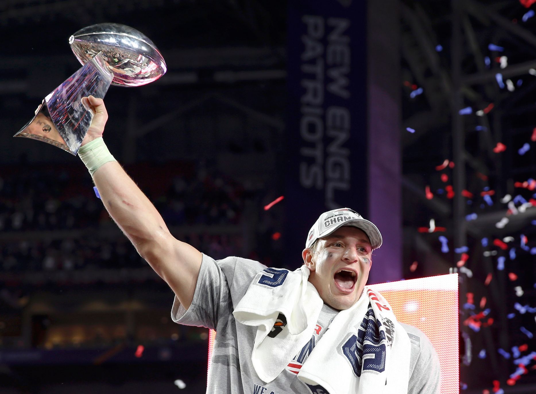 New England Patriots tight end Rob Gronkowski holds up the Vince Lombardi Trophy after his team defeated the Seattle Seahawks in the NFL Super Bowl XLIX football game in Glendale