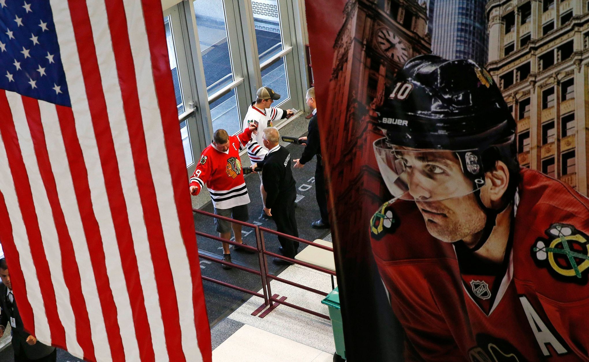 Chicago Blackhawks fans are screened by security as they ent