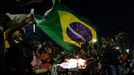 Demonstrators burn a Brazilian flag during a protest against the 2014 World Cup in Rio de Janeiro May 15, 2014. Brazilians opposed to the World Cup and the public funds s