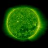 A coronal hole, the dark spot beginning just below the sun's center and extending to the right, is shown opening up in this image by NASA satellite STEREO. The NASA satellite SABER has detected a periodic "breathing" response in the Earth's upper atmosphere in response to never before observed regular coronal hole openings on the sun's surface. The coronal holes release high-powered solar winds that disturb the upper atmosphere of Earth and force it to emit energy to maintain the earth's radiation budget. Image credit: NASA/STEREO