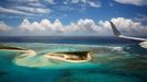 The wing tip of Air Force One can be seen as Obama lands at Henderson Field to visit the Papahanaumokuakea Marine National Monument, Midway Atoll, U.S.