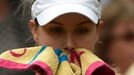 Eugenie Bouchard of Canada sits in her seat after losing the first set in her women's singles final tennis match against Petra Kvitova of the Czech Republic at the Wimble