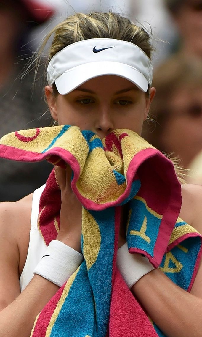 Eugenie Bouchard of Canada sits in her seat after losing the first set in her women's singles final tennis match against Petra Kvitova of the Czech Republic at the Wimble