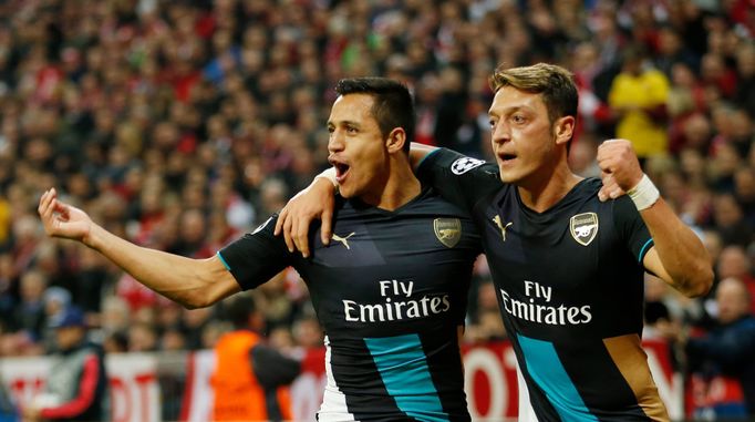 5 Arsenal's Mesut Ozil celebrates with Alexis Sanchez after scoring a goal but it is later disallowed