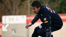 Red Bull Formula One driver Daniil Kvyat of Russia jumps a fence as he warms up in the paddock before the fourth testing session ahead the upcoming season at the Circuit