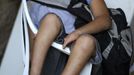 Gabriel Muniz, 11, sits in a chair at home in Campos dos Goytacazes, 274 kilometres (170 miles) northeast of Rio de Janeiro August 22, 2012. Despite being born with malformation of his feet, fourth grader Gabriel puts in hours into soccer everyday in his neighbourhood. He aspires to be a professional soccer player just like his idol Argentina's Lionel Messi of Barcelona FC. REUTERS/Ricardo Moraes (BRAZIL - Tags: SPORT SOCCER SOCIETY HEALTH) Published: Srp. 24, 2012, 2:26 dop.