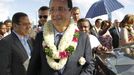 Francois Hollande, Socialist party candidate for the 2012 French presidential election, arrives at the airport in Dzaoudzi on the Indian Ocean island of Mayotte