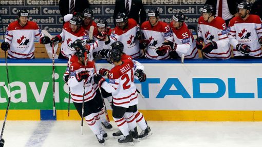 Canada's players celebrate the goal of team mate Kevin Bieska (obscured) against Sweden during the second period of their men's ice hockey World Championship Group A game