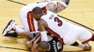 Miami Heat's Dwyane Wade (3) and Chris Andersen scramble for the ball with San Antonio Spurs' Tony Parker during the fourth quarter in Game 7 of their NBA Finals basketba