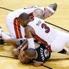 Heat's Wade and Andersen scramble for the ball with Spurs' P