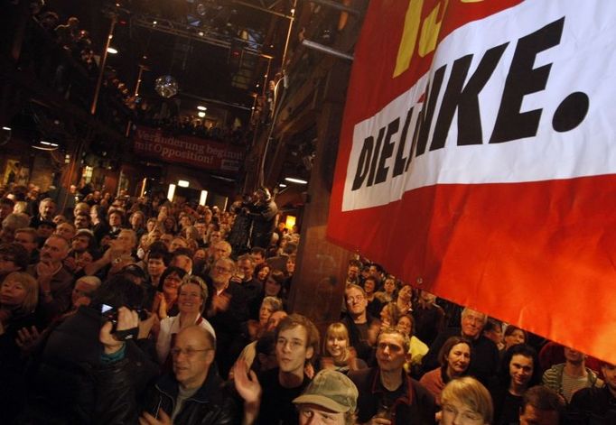 Members of the German socialist Die Linke party react as they watch first poll results in the German federal state of Hamburg February 24, 2008. German Chancellor Angela Merkel's conservatives appeared on track to retain power in an election in the northern city-state of Hamburg on Sunday which also delivered gains for a new far-left party. REUTERS/Johannes Eisele (GERMANY)