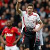 Liverpool's Gerrard celebrates scoring a penalty against Manchester United during their English Premier League soccer match in Manchester