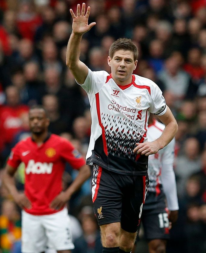 Liverpool's Gerrard celebrates scoring a penalty against Manchester United during their English Premier League soccer match in Manchester