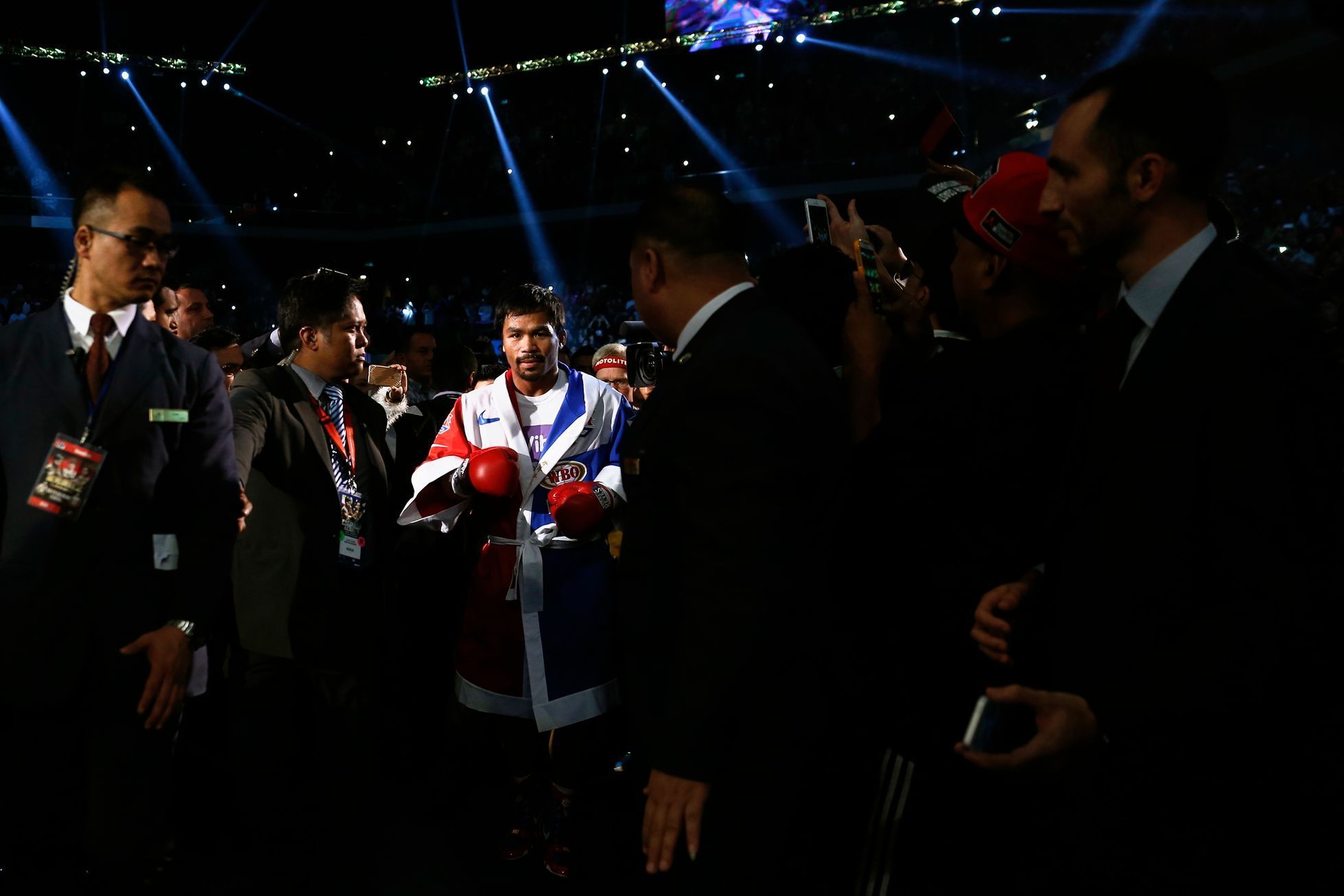 Pacquiao of the Philippines walks into to the ring before his WBO12-round welterweight title fight against Algieri of the U.S. in Macau