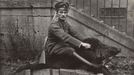 A German Air Force Officer sits astride a dead boar outside a house where he is stationed near the Western Front, in this 1918 handout picture.