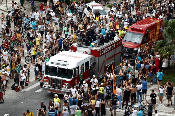 Soccer Football - Death of Brazilian soccer legend Pele - Santos, Brazil - January 3, 2023 General view of fans as the casket of Brazilian soccer legend Pele is transport