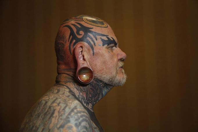 Robert Seibert, 62, from Burlington, Kentucky, shows off his full body of tattoos, including the tribal-inspired designs he has accumulated over 40 years, during the National Tattoo Association Convention in Cincinnati, Ohio April 14, 2012. Of his art, Seibert says, "I'm one of the people that can't have a favorite tattoo, each is like a certain phase of my life. To me it's a picture history of what I have gone through, through the years." Picture taken April 14, 2012. REUTERS/Jason Reed (UNITED STATES - Tags: SOCIETY TPX IMAGES OF THE DAY) ATTENTION EDITORS PICTURE 01 31 FOR PACKAGE 'ADDICTED TO NEEDLE' TO FIND ALL PICTURES SEARCH 'ADDICTED NEEDLE'