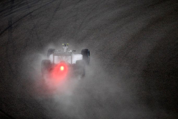 Mercedes Formula One driver Nico Rosberg of Germany brakes as he drives during the qualifying session of the Chinese F1 Grand Prix at the Shanghai International circuit,