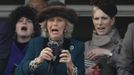 Britain's Camilla (C), Duchess of Cornwall, and Zara Phillips (R) react during The Queen Mother Champion Chase at the Cheltenham Festival horse racing meet in Gloucestershire, western England March 14, 2012.