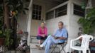 Paul Lewis (R), 82, and his wife Ruth, 84, sit outside their trailer in which they have lived for 15 years, in Village Trailer Park in Santa Monica, California, July 13, 2012. Developer Marc Luzzatto wants to relocate residents from the trailer park to make way for nearly 500 residences, office space, stores, cafes and yoga studios, close to where a light rail line is being built to connect downtown Los Angeles to the ocean. Village Trailer Park was built in 1951, and 90 percent of its residents are elderly, disabled or both, according to the Legal Aid Society. Many have lived there for decades in old trailers which they bought. The property is valued at as much as $30 million, according the LA Times. REUTERS/Lucy Nicholson (UNITED STATES - Tags: REAL ESTATE BUSINESS SOCIETY POLITICS) Published: Čec. 14, 2012, 7:54 dop.