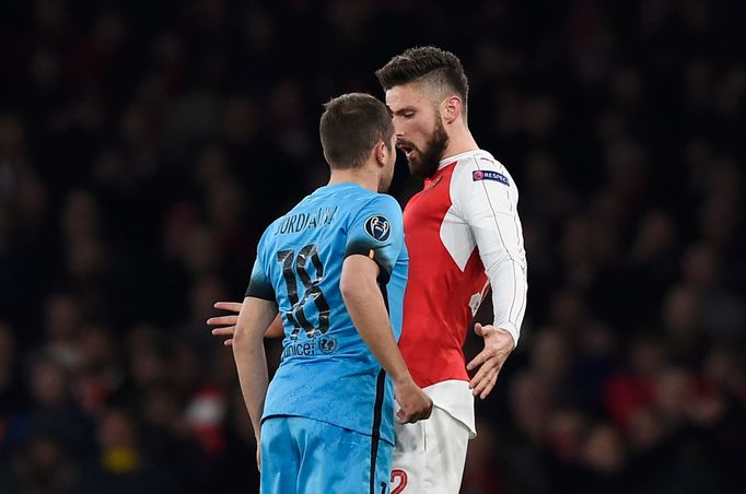 Barcelona's Jordi Alba clashes with Arsenal's Olivier Giroud