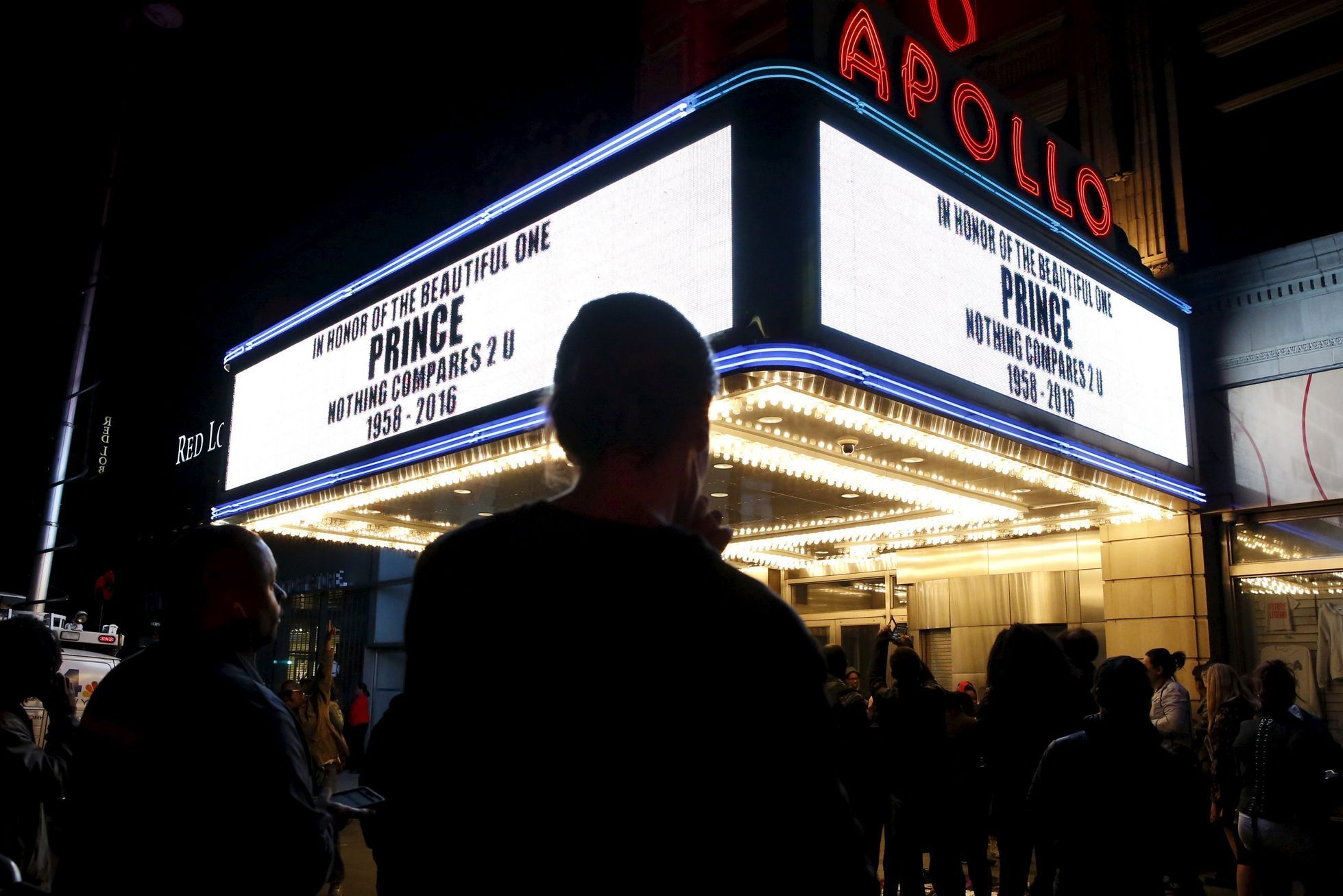 The marquee at Harlem's Apollo Theater pays tribute to deceased musician Prince as fans gather to celebrate his life and music in the Manhattan borough of New York, U.S.